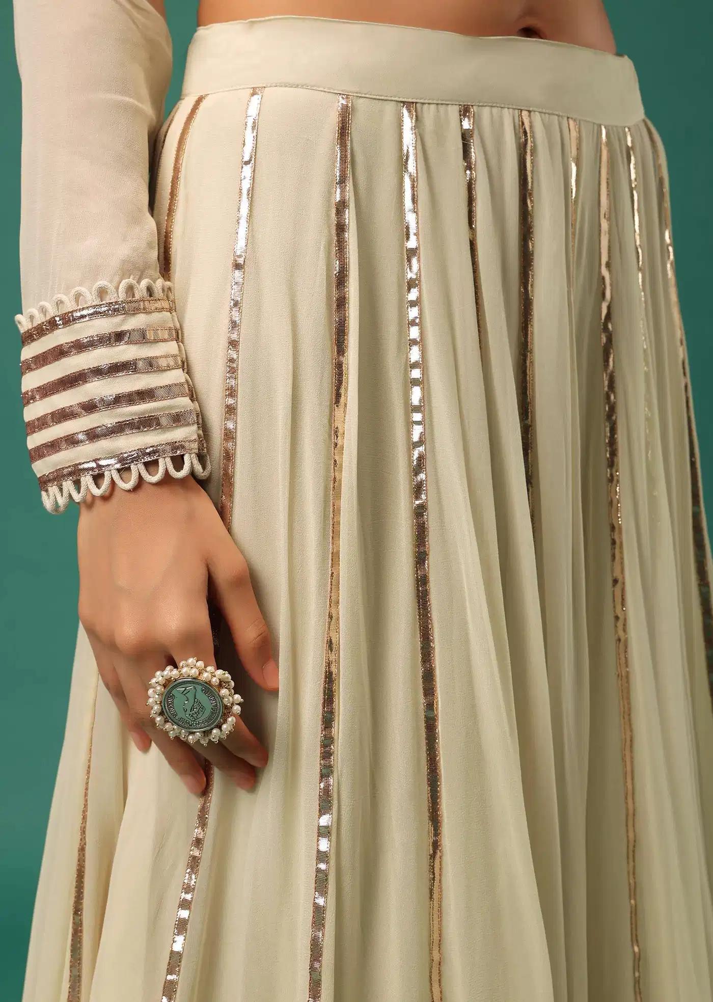 Cream White Handcrafted Lehenga Skirt Ensemble Featuring Peplum Top In Georgette