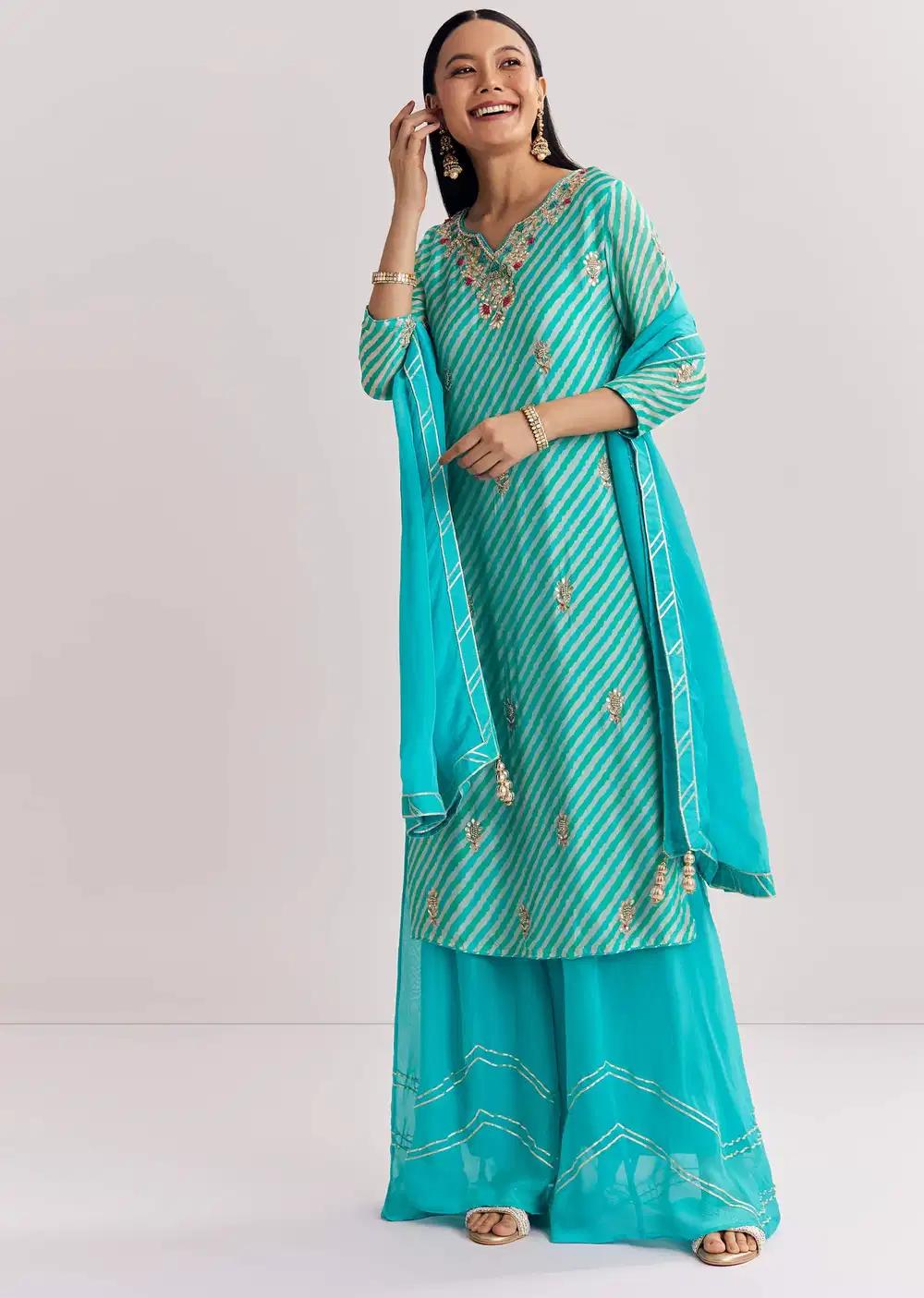 Baby Pink Georgette Tunic Palazzo Trousers Outfit Featuring Organza Drape Moti Detailing