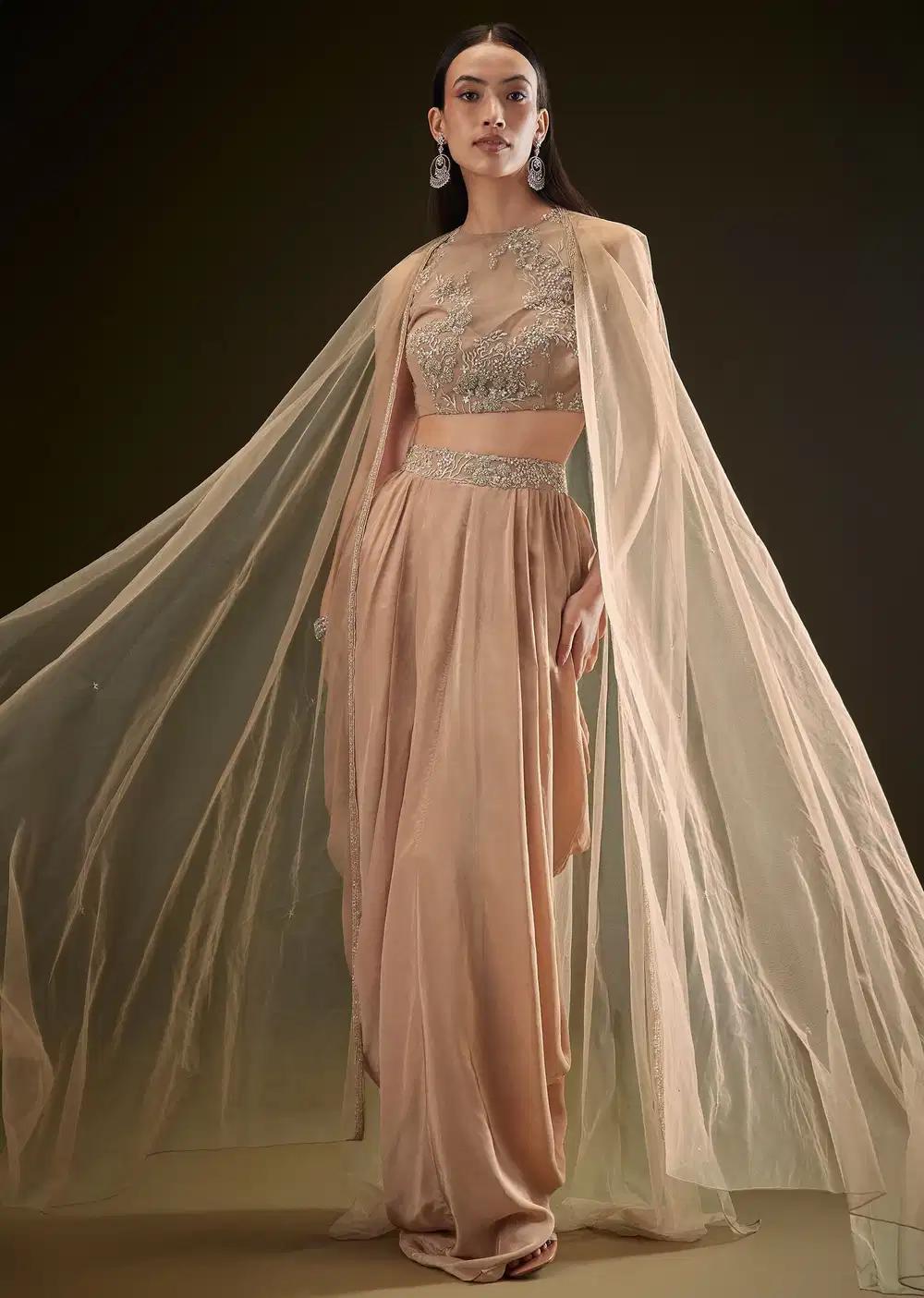 Beige Dhoti Skirt Set With Embroidered Bustier And Cape