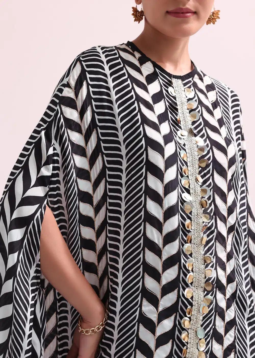 Boho Style Printed Black Kurta Pant Ensemble With Matching Potali Outfit