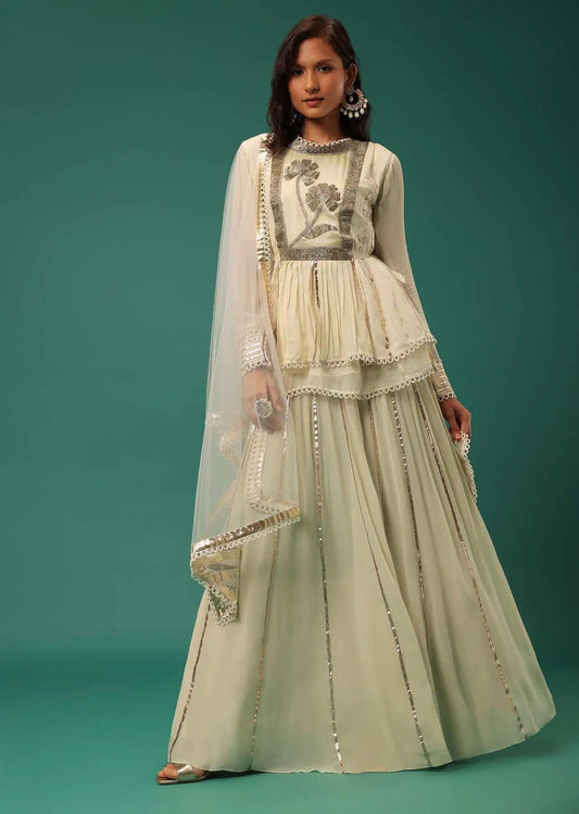 Cream White Handcrafted Lehenga Skirt Ensemble Featuring Peplum Top In Georgette