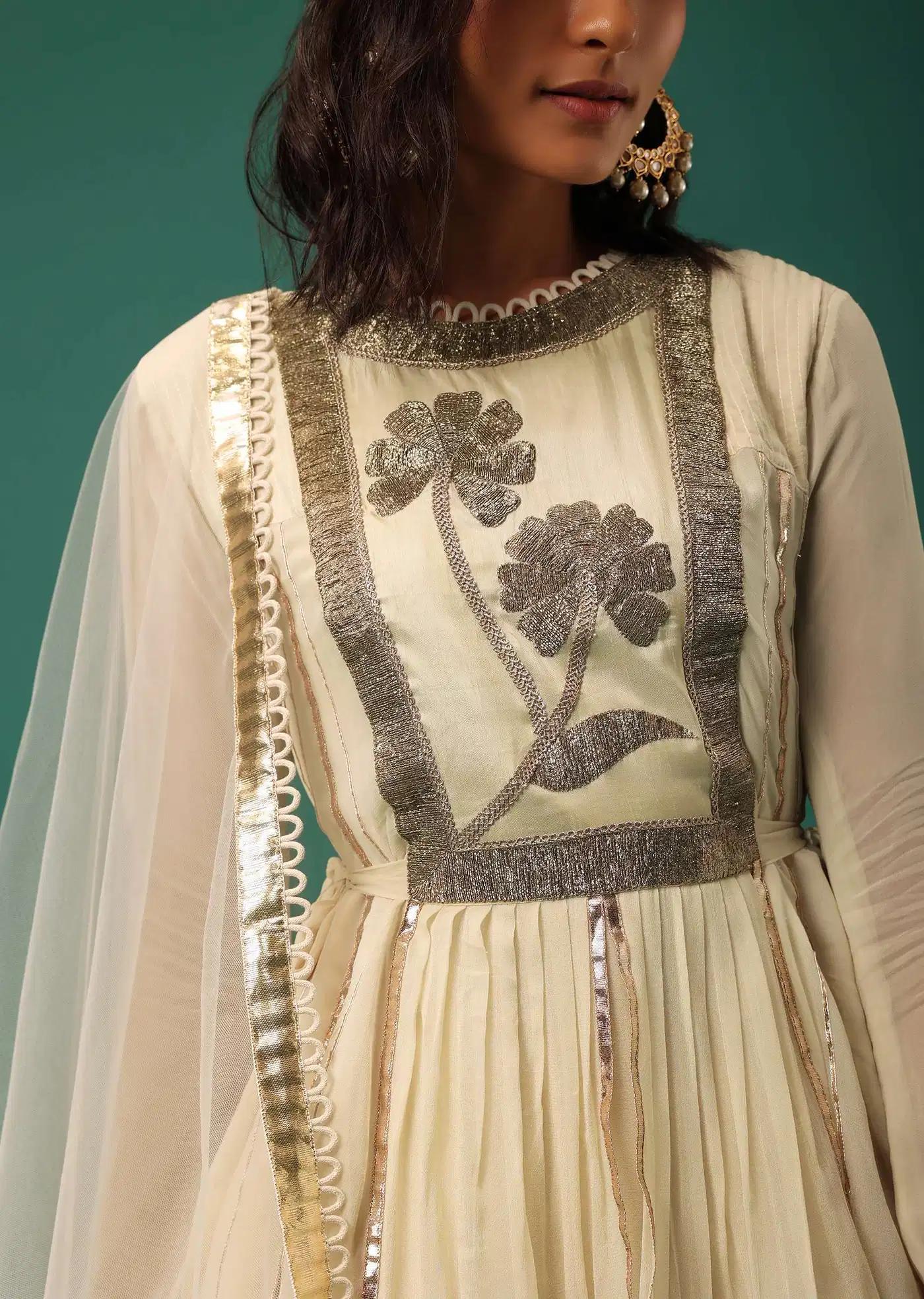 Cream White Handcrafted Lehenga Skirt Ensemble Featuring Peplum Top In Georgette