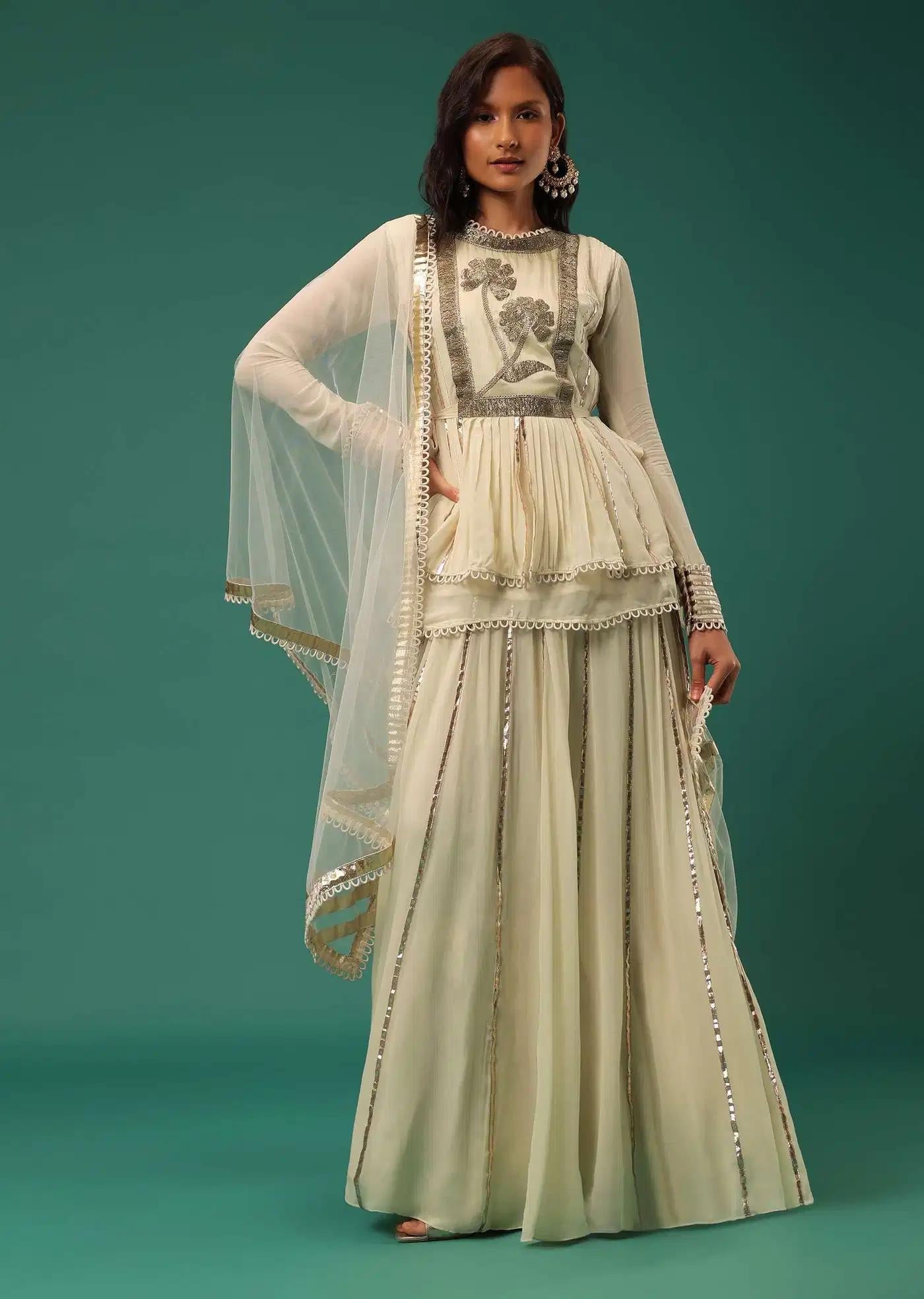 Cream White Handcrafted Lehenga Skirt Ensemble Featuring Peplum Top In Georgette