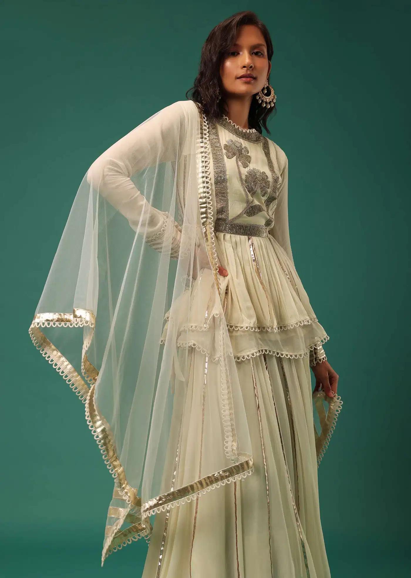Cream White Handcrafted Lehenga Skirt Ensemble Featuring Peplum Top In Georgette