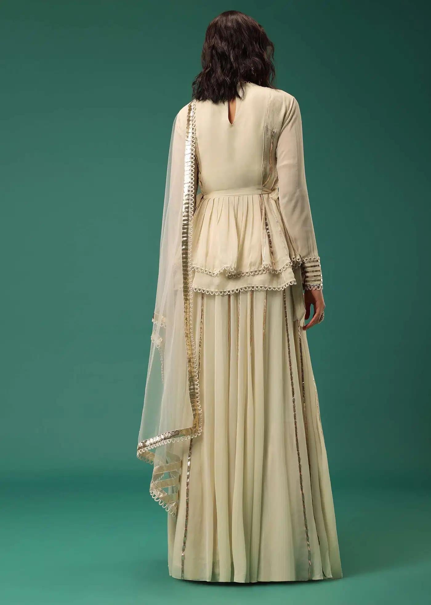 Cream White Handcrafted Lehenga Skirt Ensemble Featuring Peplum Top In Georgette