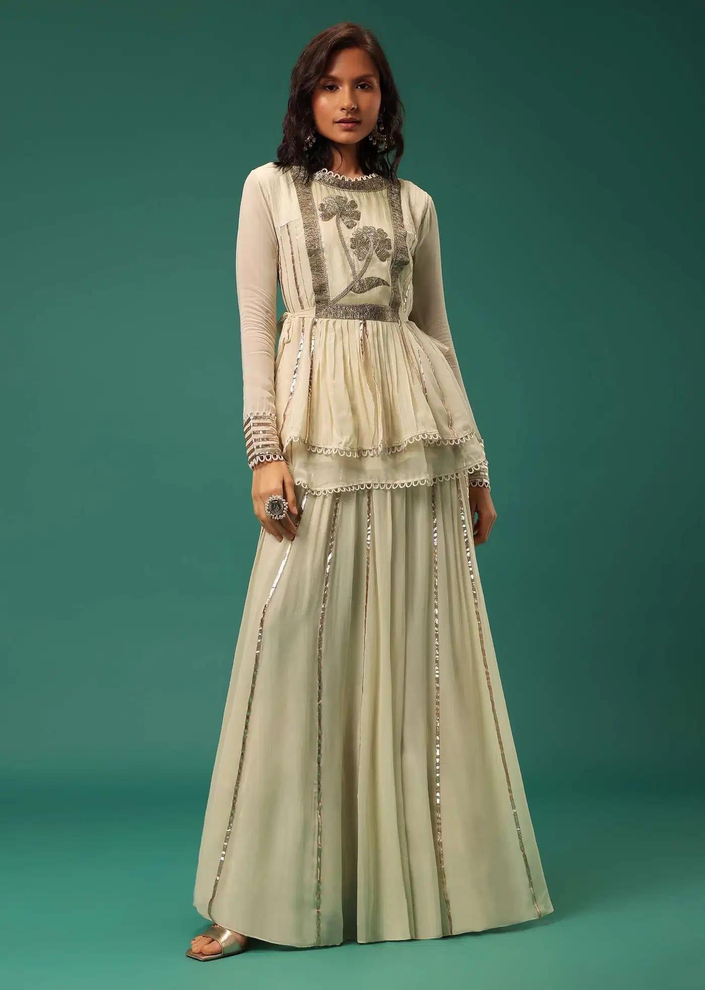 Cream White Handcrafted Lehenga Skirt Ensemble Featuring Peplum Top In Georgette