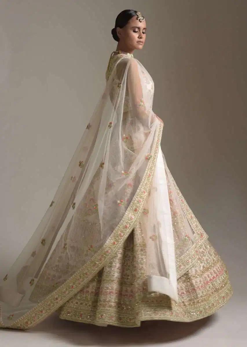 Creamy Pink Lehenga Skirt Blouse In Raw Silk Featuring Pink Resham Zardosi Handcrafted Floral Kalis Online Kalki Fashion