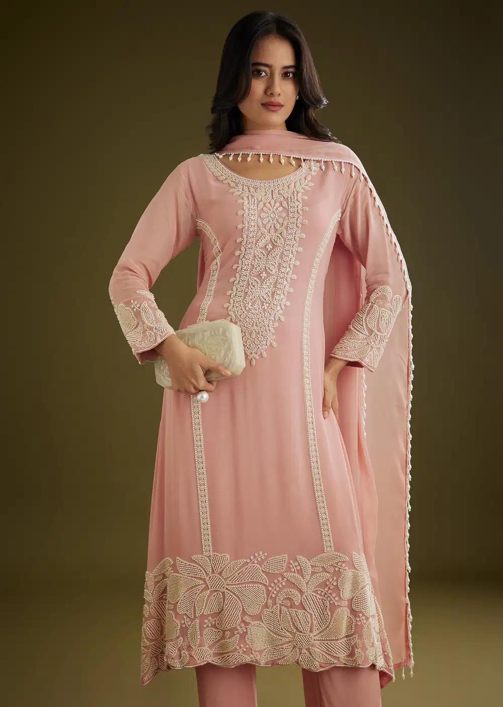 Pink Georgette Moti Work Asymmetrical Kurta Ensemble With Tassels Bordered Dupatta Outfit