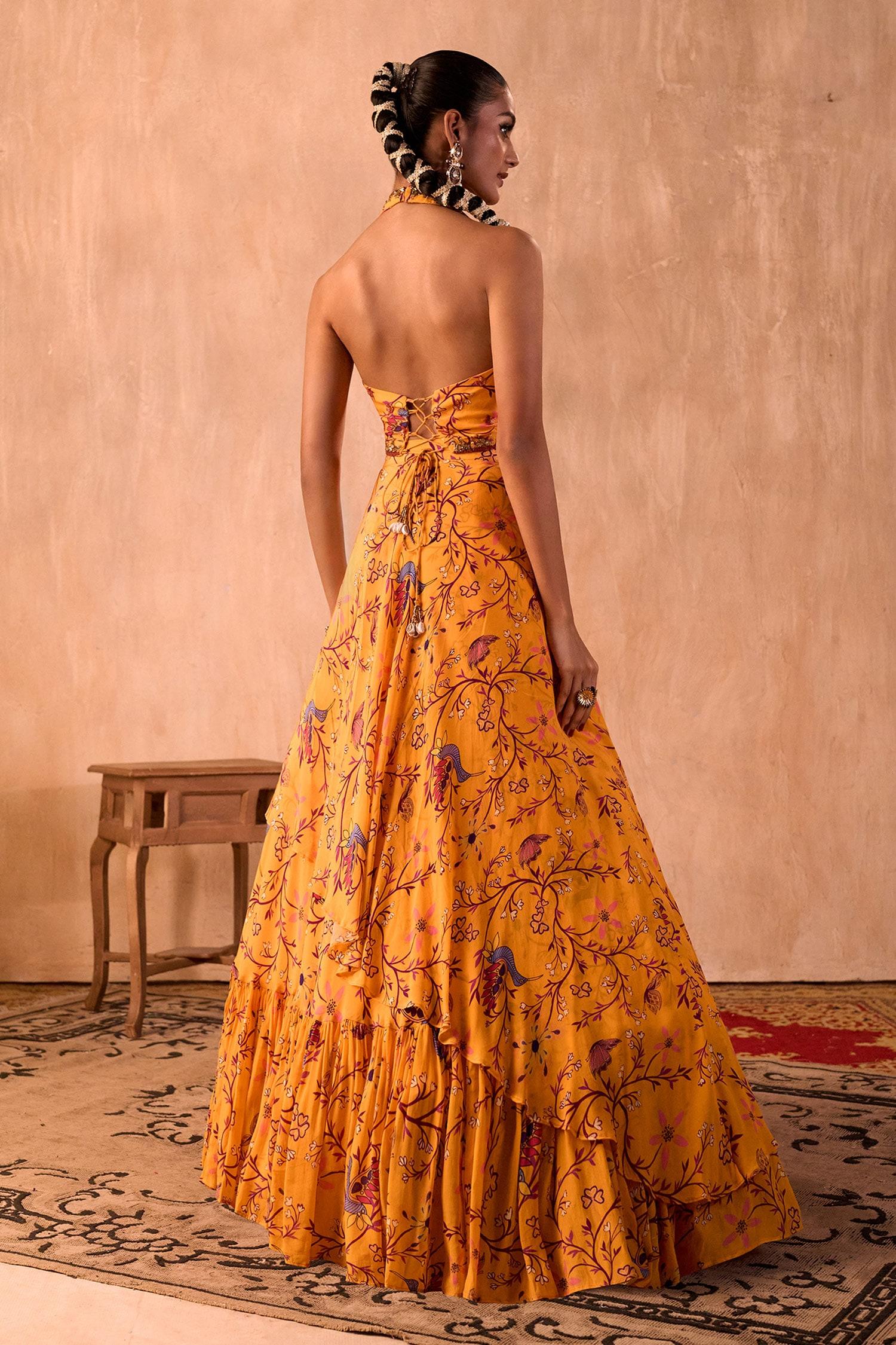 Yellow Crepe Tassels Halter Neck Floral Print Blouse And Layered Lehenga Set - Designer Kurta Set